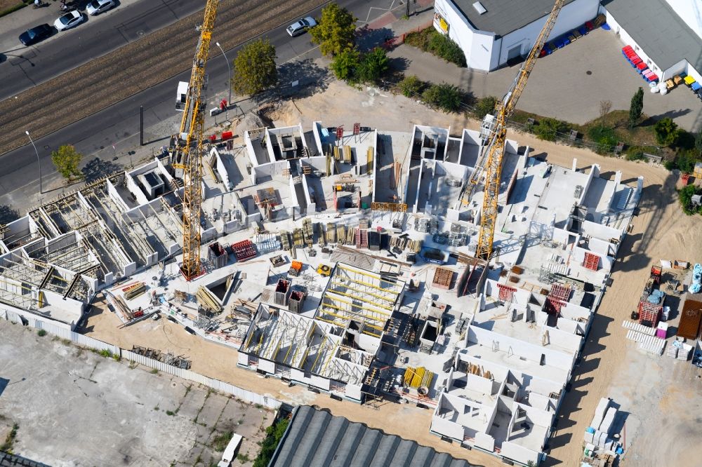 Berlin from the bird's eye view: Construction site for the new residential and commercial building on the Mahlsdorfer Strasse - Hirtenstrasse in the district Koepenick in Berlin, Germany