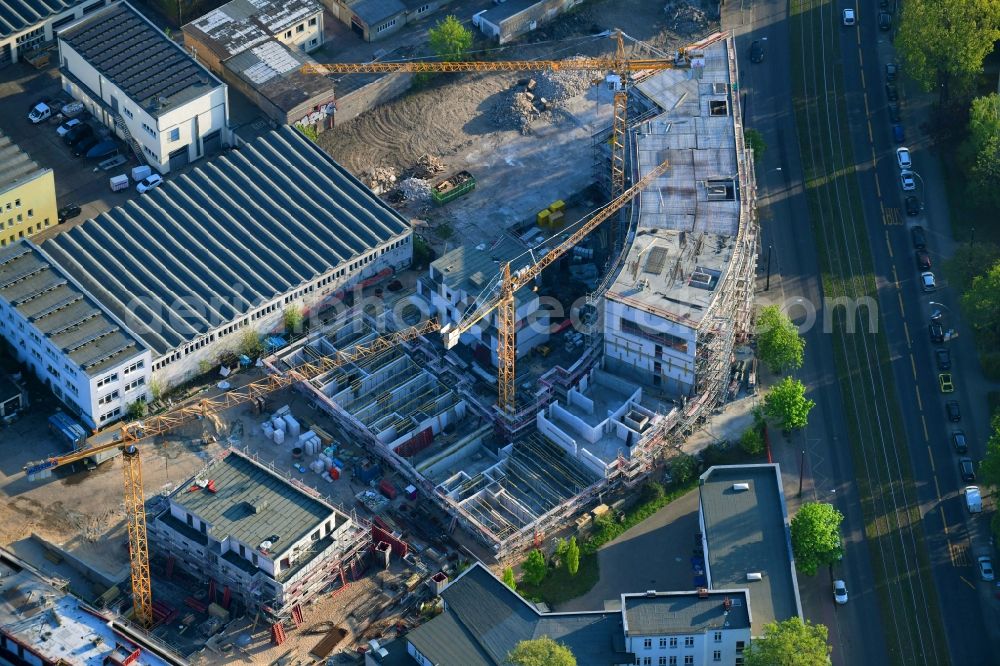 Berlin from the bird's eye view: Construction site for the new residential and commercial building on the Mahlsdorfer Strasse - Hirtenstrasse in the district Koepenick in Berlin, Germany