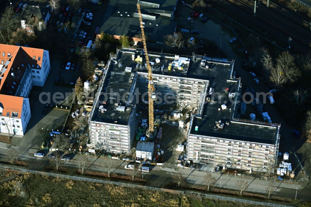 Falkensee from the bird's eye view: Construction site for the new residential and commercial building Schwartzkopffstrasse corner Leipziger Strasse in Falkensee in the state Brandenburg, Germany
