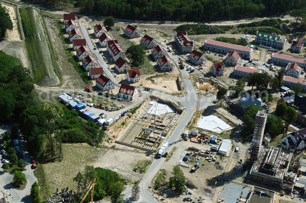 Beelitz from the bird's eye view: Residential area construction site of a mixed development with multi-family houses and single-family houses- New building at the Quartier Beelitz-Heilstaetten in Beelitz in the state Brandenburg, Germany