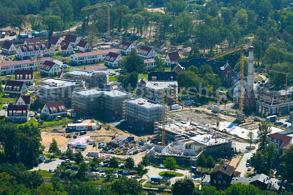 Aerial photograph Beelitz - Residential area construction site of a mixed development with multi-family houses and single-family houses- New building at the Quartier Beelitz-Heilstaetten in Beelitz in the state Brandenburg, Germany