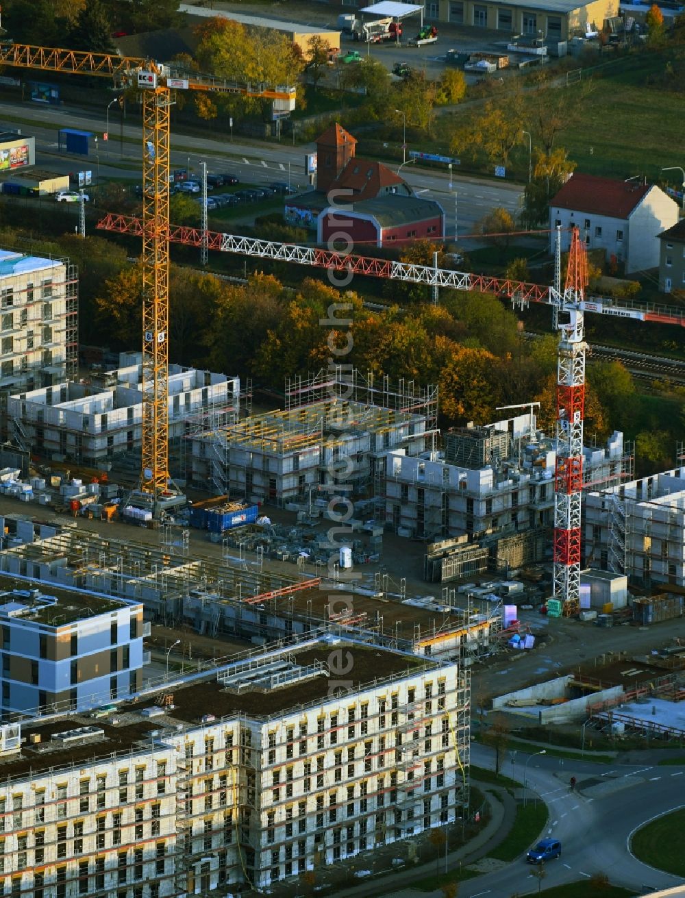 Schönefeld from the bird's eye view: Construction site for the multi-family residential building on Aldebaranstrasse in Schoenefeld in the state Brandenburg, Germany