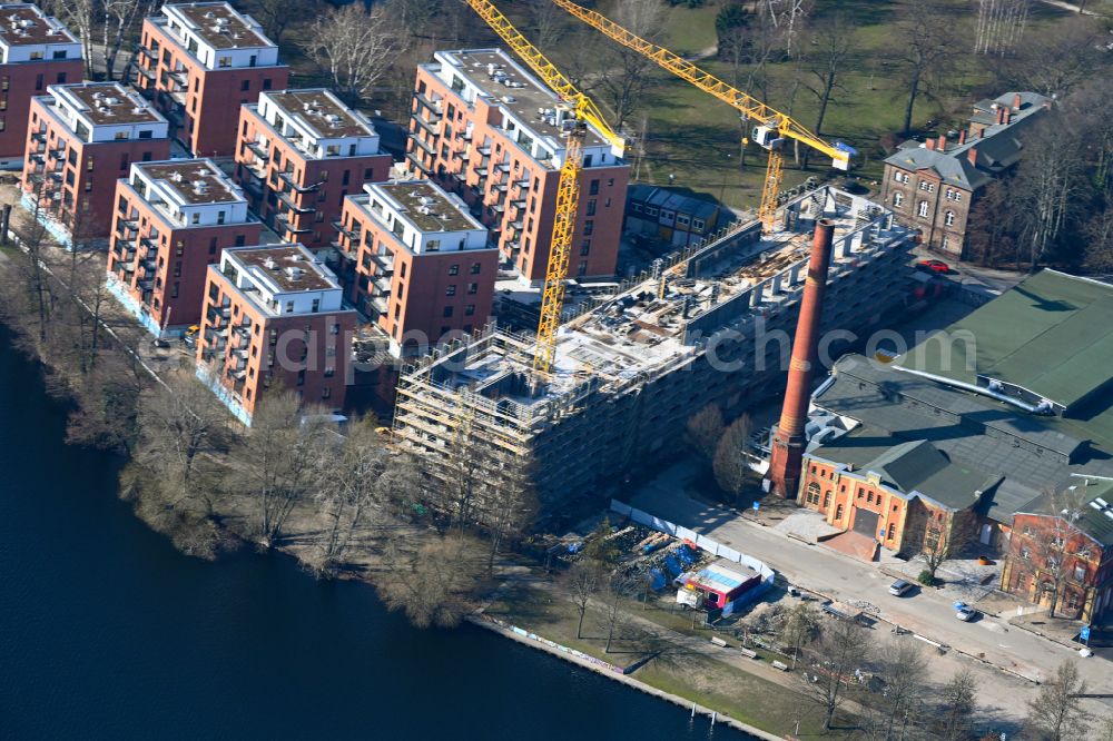 Berlin from above - Construction site for the construction of a new multi-family residential building on Eiswerderstrasse on the island of Eiswerder in the Spandau Hakenfelde district in Berlin, Germany