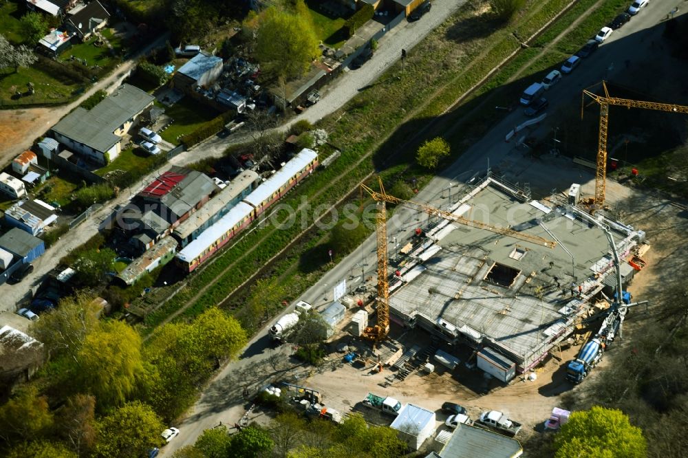 Berlin from the bird's eye view: Construction site for the new construction of an apartment building on Bruchstueckegraben in the Maerkisches Viertel district in Berlin, Germany