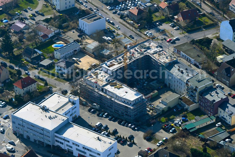 Falkensee from the bird's eye view: Construction site for the multi-family residential building on street Schwartzkopffstrasse in Falkensee in the state Brandenburg, Germany
