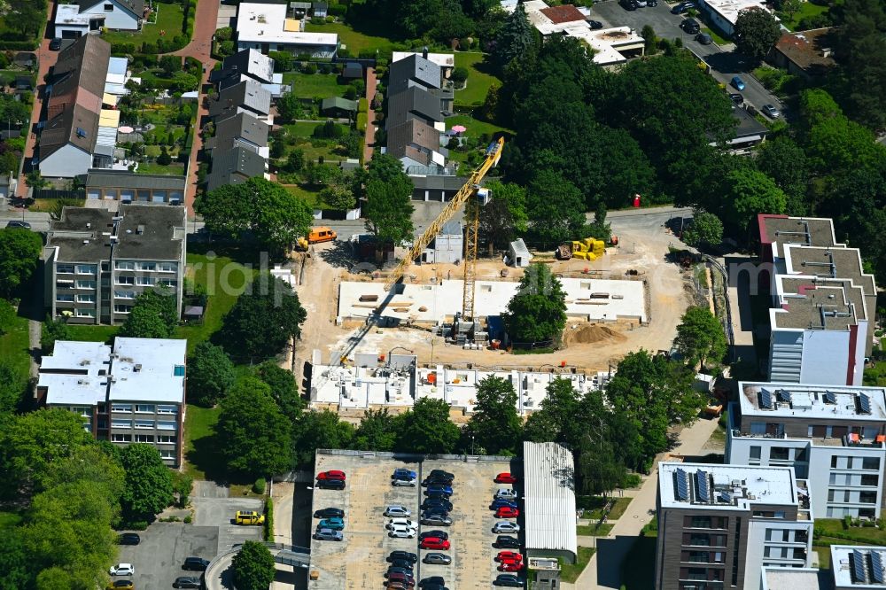 Wolfsburg from the bird's eye view: Construction site for the multi-family residential building on street John-F.-Kennedy-Allee - Am Finkenhaus in the district Detmerode in Wolfsburg in the state Lower Saxony, Germany