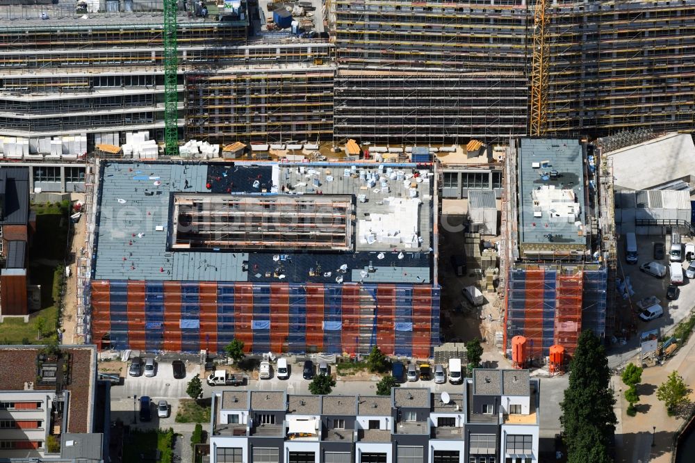 Berlin from the bird's eye view: Construction site for the multi-family residential building on Glasblaeserallee in the district Friedrichshain in Berlin, Germany