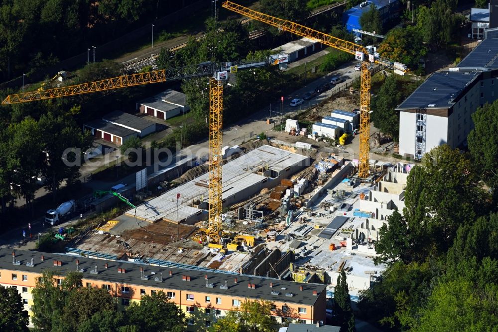 Berlin from above - Construction site for the multi-family residential building on Hartriegelstrasse - Moosstrasse in the district Niederschoeneweide in Berlin, Germany