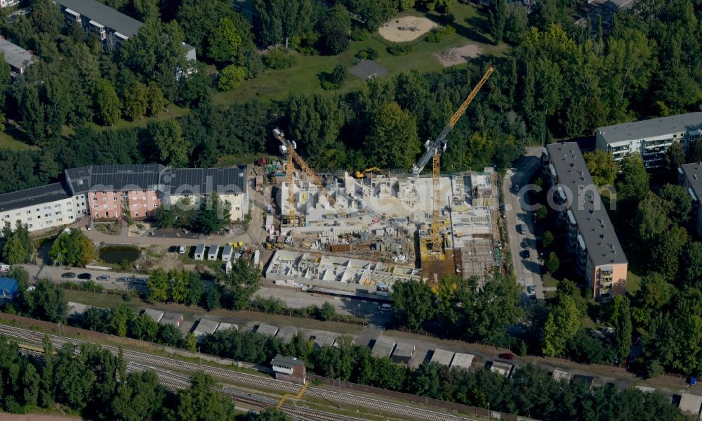 Aerial image Berlin - Construction site for the multi-family residential building on Hartriegelstrasse - Moosstrasse in the district Niederschoeneweide in Berlin, Germany