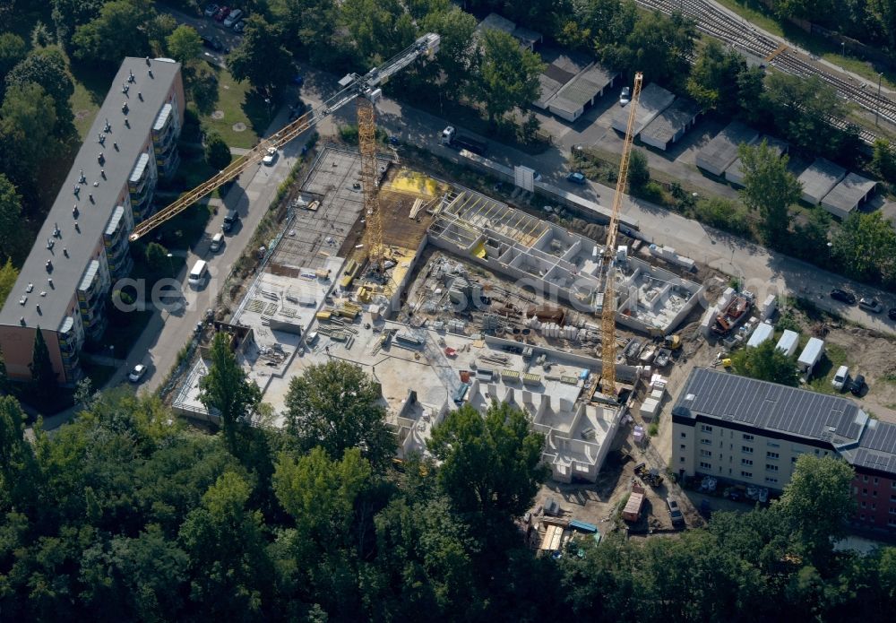 Aerial photograph Berlin - Construction site for the multi-family residential building on Hartriegelstrasse - Moosstrasse in the district Niederschoeneweide in Berlin, Germany