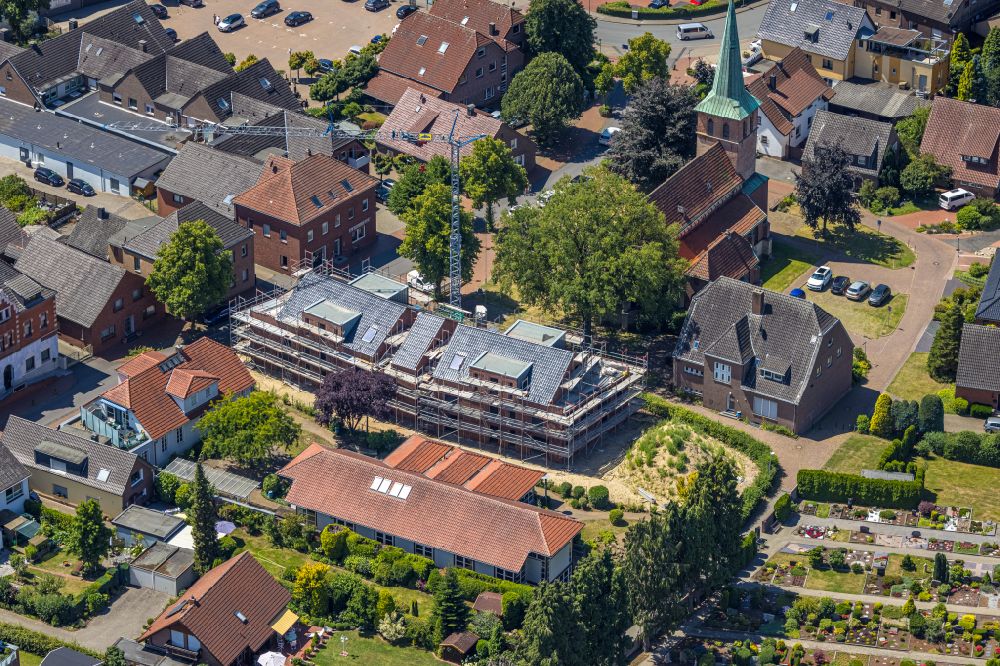 Hünxe from above - Construction site for the multi-family residential building on street Dorstener Strasse in the district Krudenburg in Huenxe at Ruhrgebiet in the state North Rhine-Westphalia, Germany