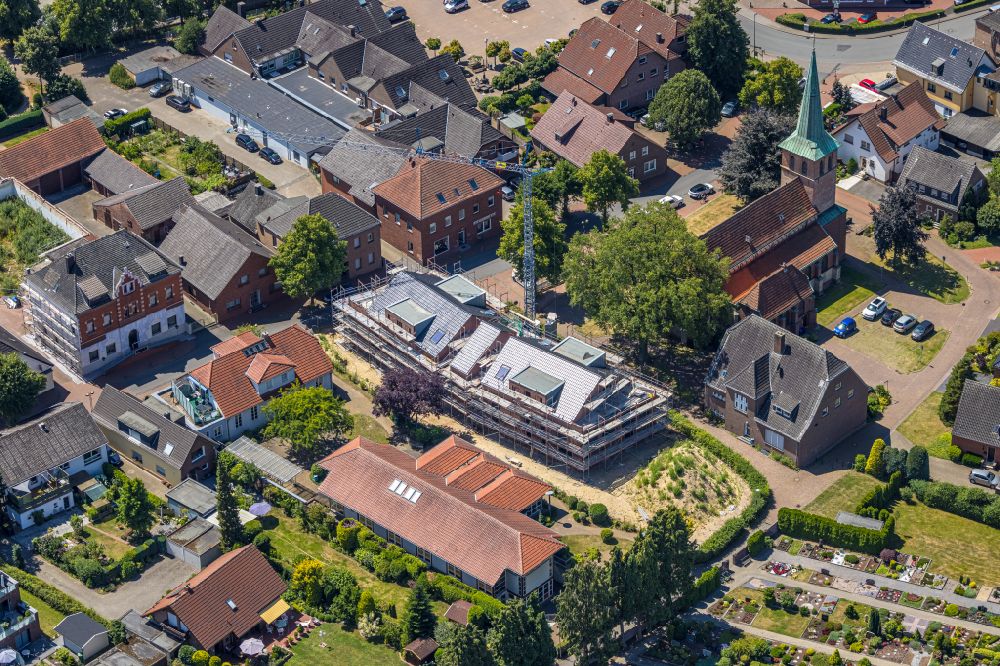 Hünxe from the bird's eye view: Construction site for the multi-family residential building on street Dorstener Strasse in the district Krudenburg in Huenxe at Ruhrgebiet in the state North Rhine-Westphalia, Germany