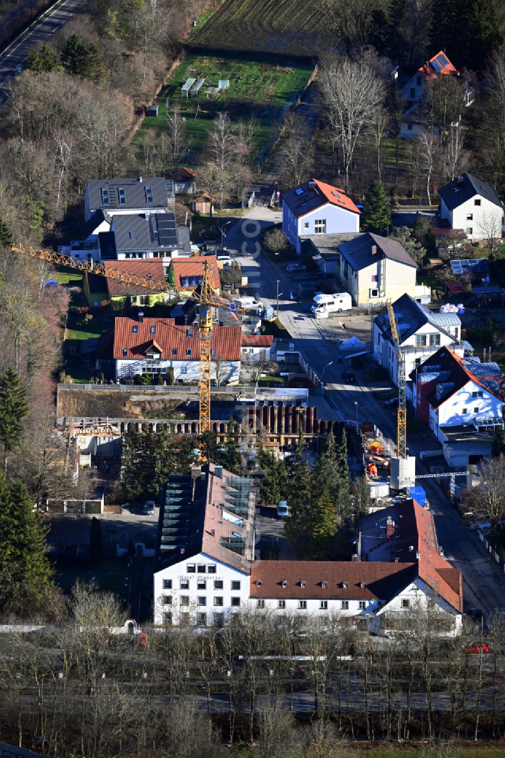 Karlsfeld from above - Construction site for the multi-family residential building on street Gruenlandstrasse in the district Rothschwaige in Karlsfeld in the state Bavaria, Germany