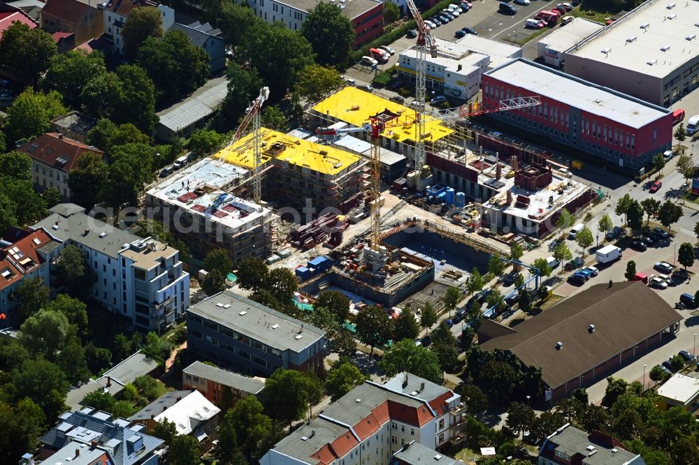 Berlin from the bird's eye view: Construction site for the multi-family residential building on Areal Otto-Fronke-Strasse - Buechnerweg - Moissistrasse - Anna-Seghers-Strasse in the district Adlershof in Berlin, Germany