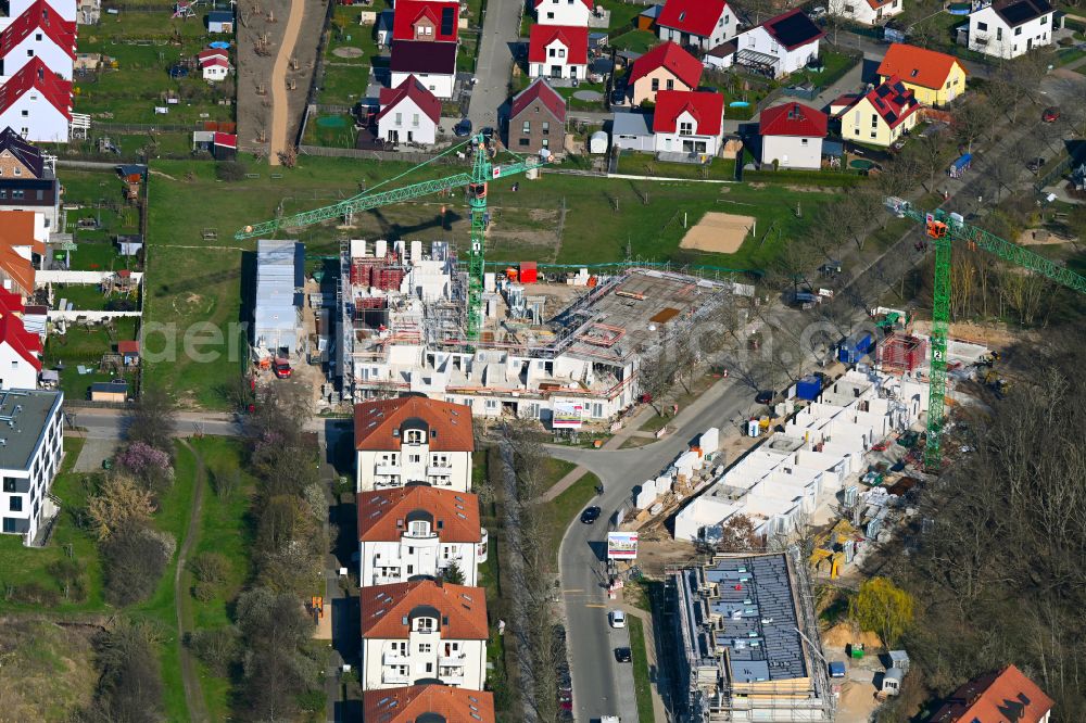 Potsdam from the bird's eye view: Construction site for the multi-family residential building on street In der Feldmark - Grasmueckenring - Taubenbogen in the district Golm in Potsdam in the state Brandenburg, Germany
