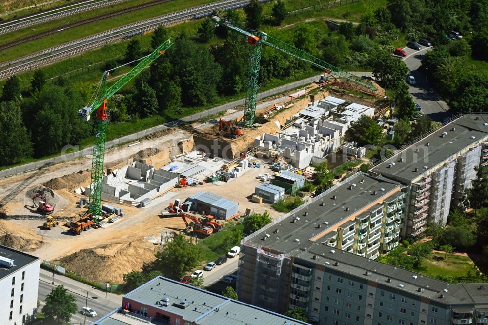 Berlin from the bird's eye view: Construction site for the multi-family residential building on Hoyerswerdaer Strasse in the district Hellersdorf in Berlin, Germany