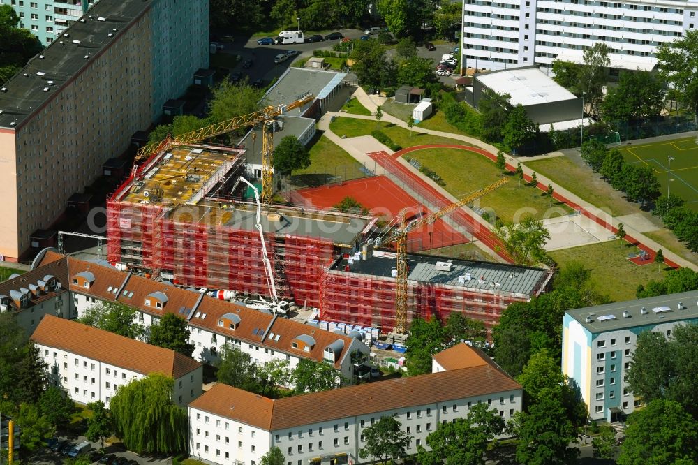 Berlin from above - Construction site for the multi-family residential building on Neustrelitzer Strasse in the district Hohenschoenhausen in Berlin, Germany
