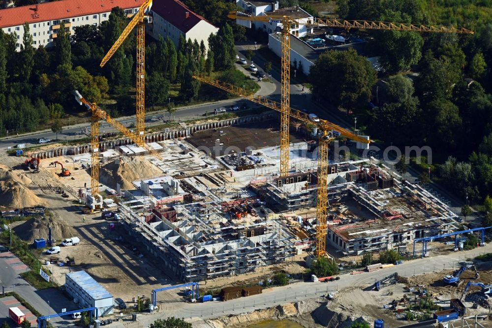 Berlin from the bird's eye view: Construction site for the multi-family residential building on Maselakepark in the district Spandau Hakenfelde in Berlin, Germany