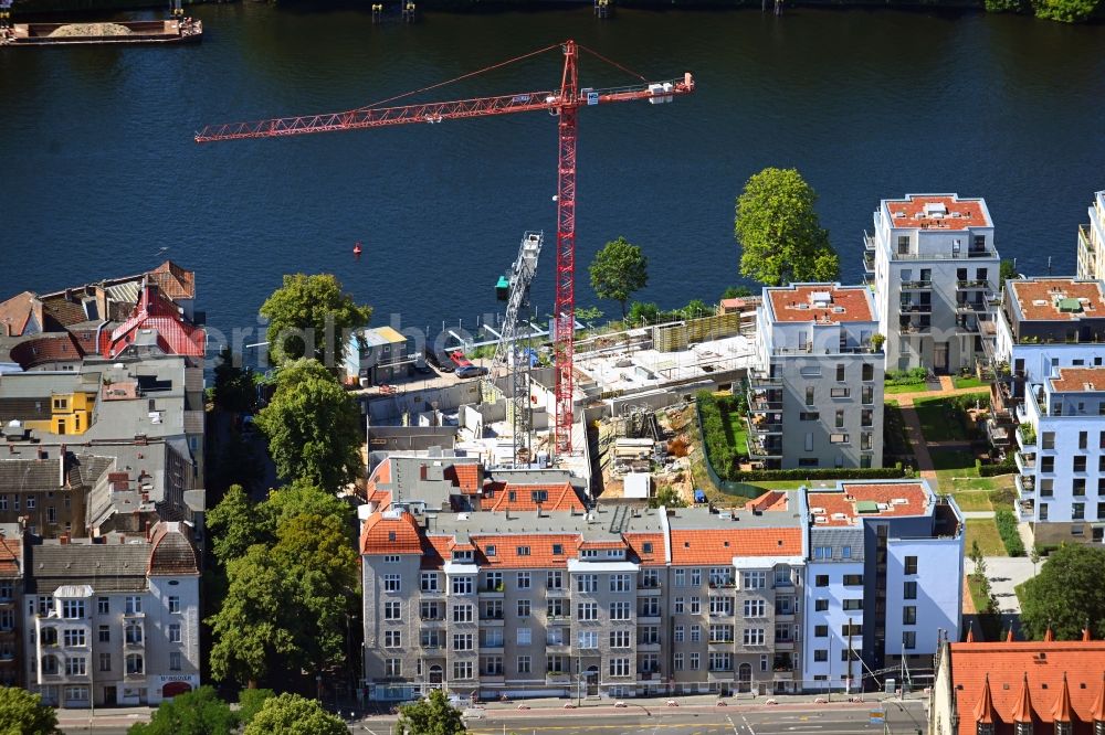 Berlin from above - Construction site for the multi-family residential building of the project BUWOG UFERKRONE Suno at the riverside of the Spree along the Lindenstrasse in the district Koepenick in Berlin, Germany