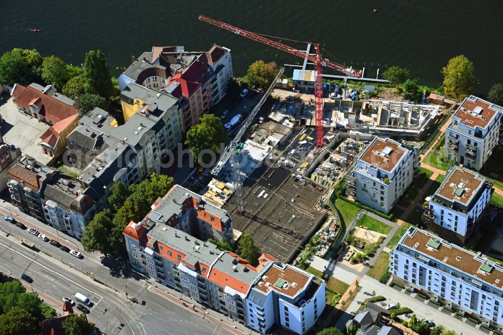 Berlin from above - Construction site for the multi-family residential building of the project BUWOG UFERKRONE Suno at the riverside of the Spree along the Lindenstrasse in the district Koepenick in Berlin, Germany