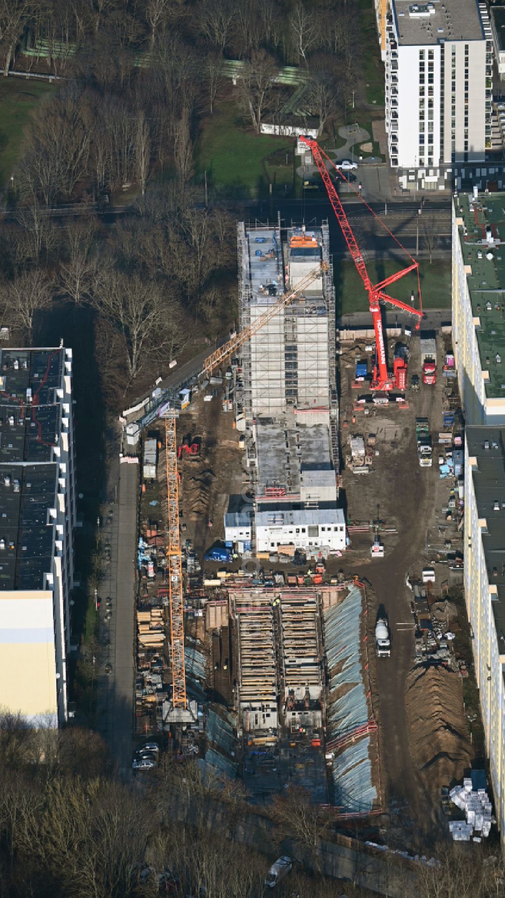 Berlin from the bird's eye view: Construction site for the multi-family residential building with Studentenapartments of Belinovo Grundstuecksentwicklung GmbH on street Rhinstrasse in the district Friedrichsfelde in Berlin, Germany