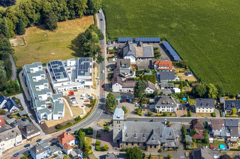 Menden (Sauerland) from the bird's eye view: Construction site for the multi-family residential building Wohnpark Holzener Heide on Heidestrasse in Menden (Sauerland) in the state North Rhine-Westphalia, Germany