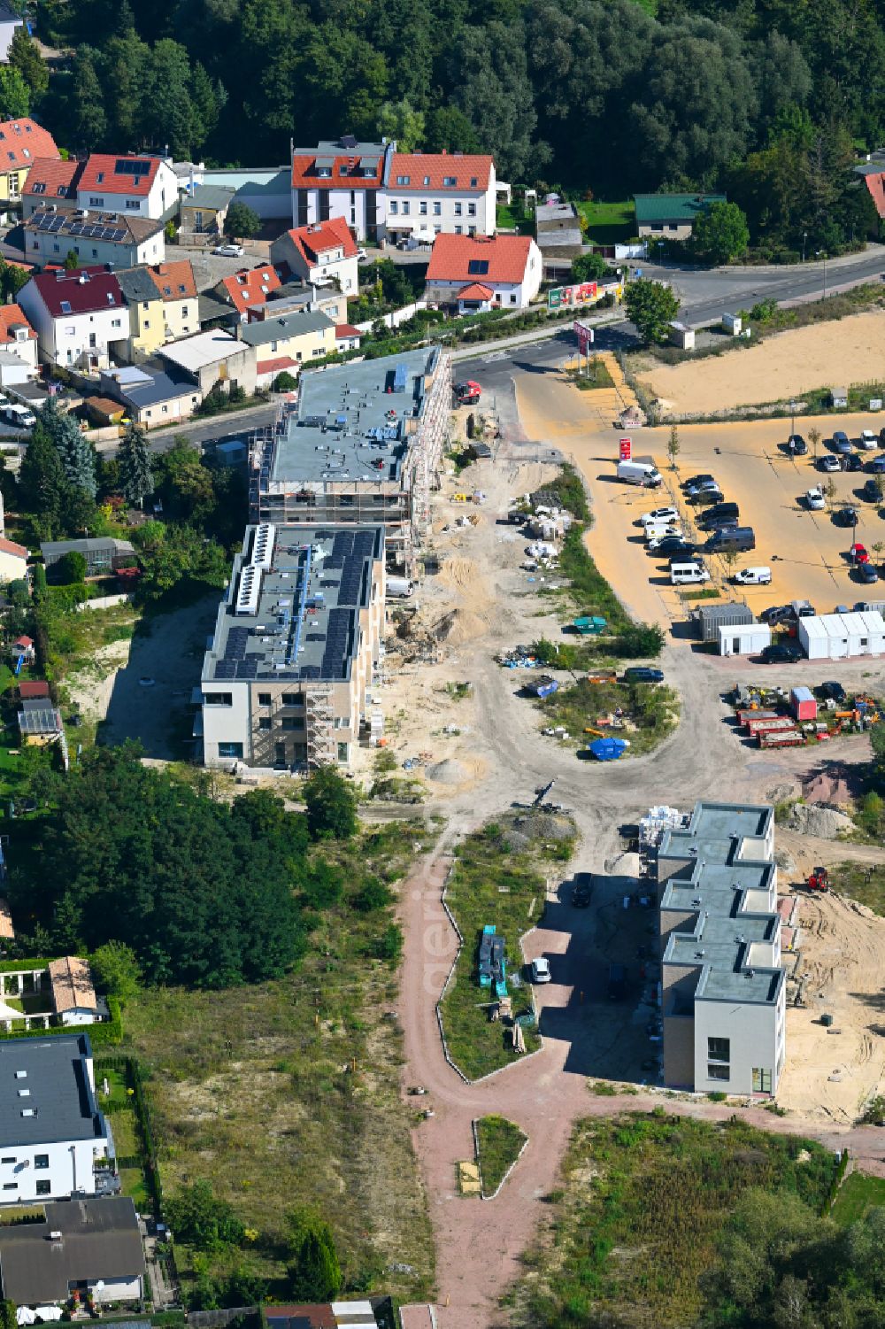 Caputh from the bird's eye view: Construction site for the new construction of two multi-family residential buildings in the Blumenviertel on street Kirschanger in Caputh in the state Brandenburg, Germany