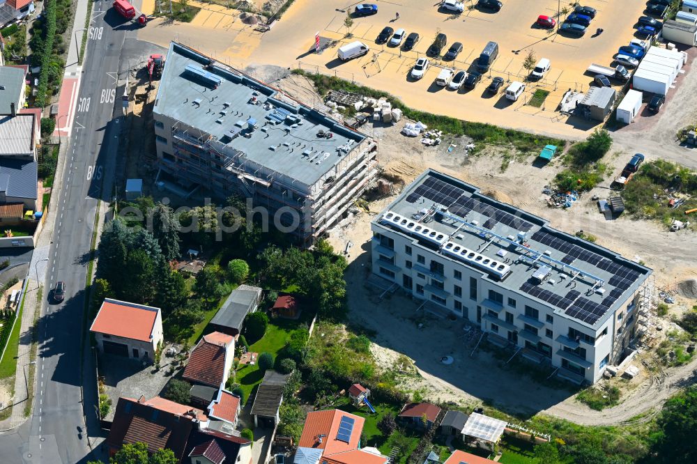 Caputh from the bird's eye view: Construction site for the new construction of two multi-family residential buildings in the Blumenviertel on street Kirschanger in Caputh in the state Brandenburg, Germany