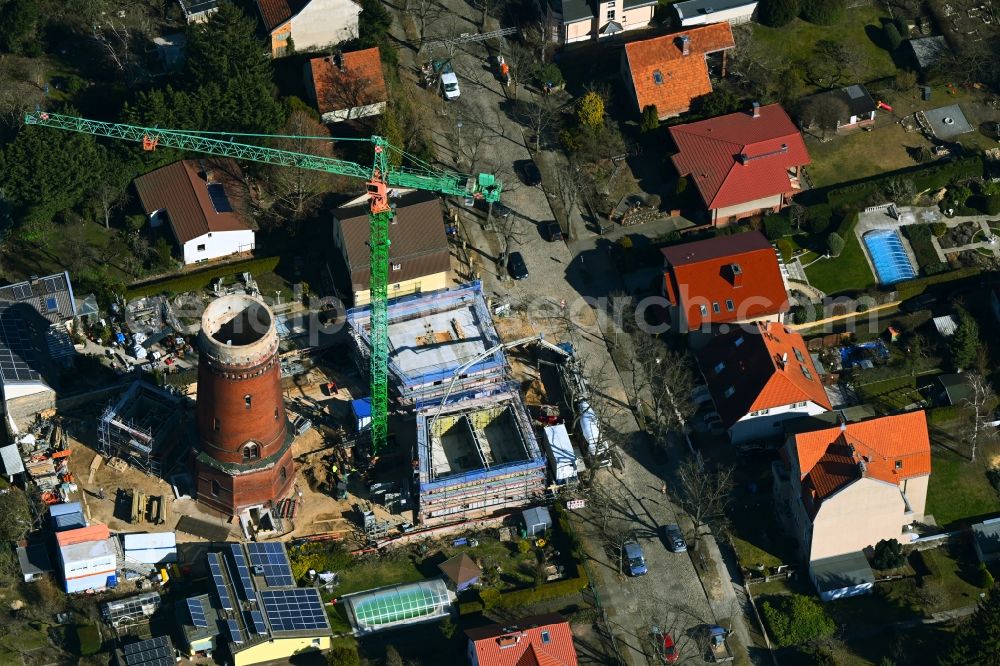 Berlin from above - Construction site for the construction of two new residential buildings and conversion of the water tower into a residential building on Schirnerstrasse in the district of Altglienicke in Berlin, Germany