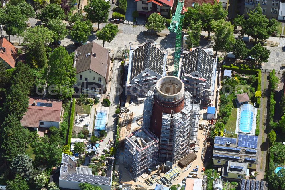 Aerial photograph Berlin - Construction site for the construction of two new residential buildings and conversion of the water tower into a residential building on Schirnerstrasse in the district of Altglienicke in Berlin, Germany