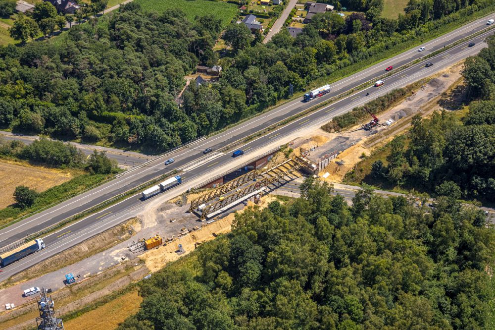 Hünxe from the bird's eye view: Construction site for the rehabilitation and repair of the motorway bridge construction of BAB 3 on Dinslakener Strasse in Huenxe in the state North Rhine-Westphalia, Germany