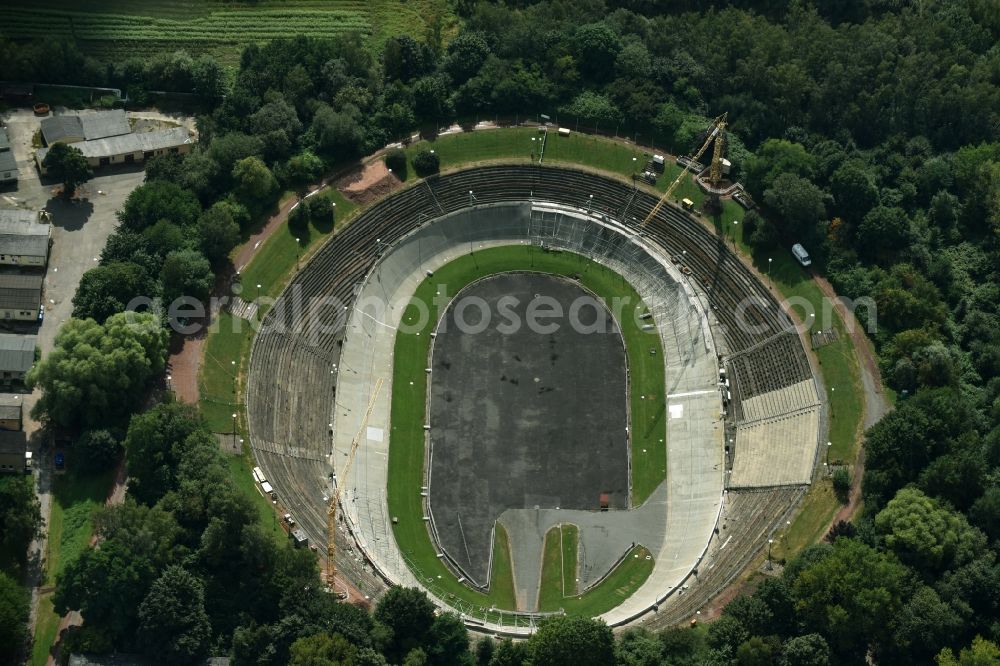 Aerial photograph Chemnitz - Construction site for the restoration and redevelopment of the bicycle race track in the Bernsdorf part of Chemnitz in the state of Saxony. The concrete oval track is being refurbished