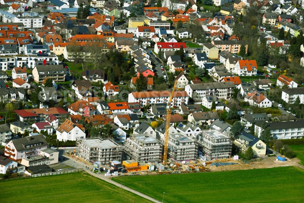 Nieder-Eschbach from the bird's eye view: Residential areas - Construction site with multi-family housing development - New building on the outskirts of the town in Nieder-Eschbach in the state of Hesse, Germany
