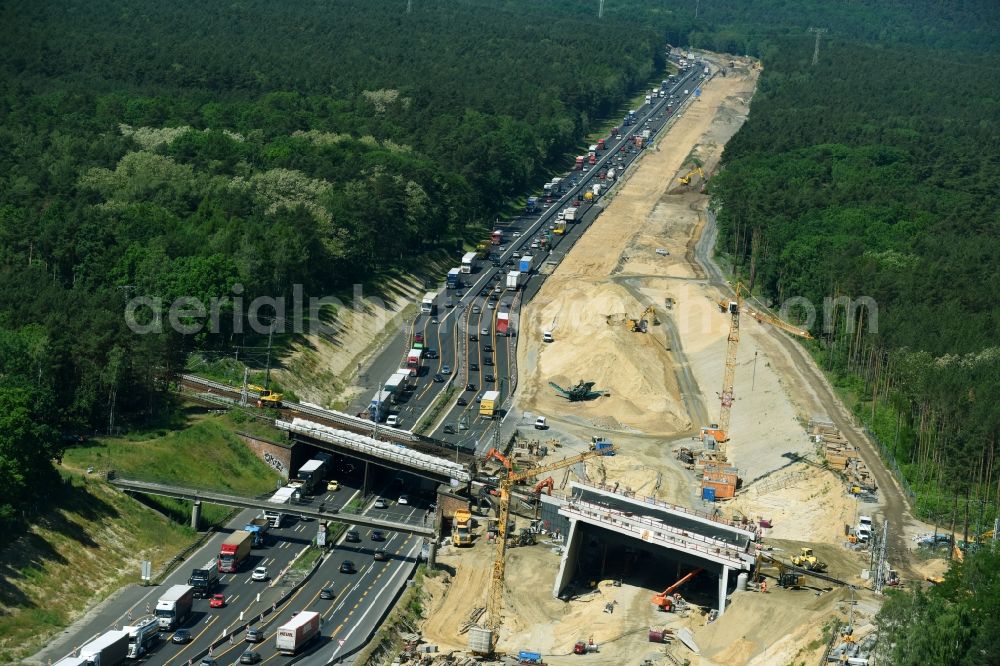 Aerial photograph Michendorf - Construction for the renovation of the railway bridge building to route the train tracks crossing course of motorway BAB A10 in Michendorf in the state Brandenburg