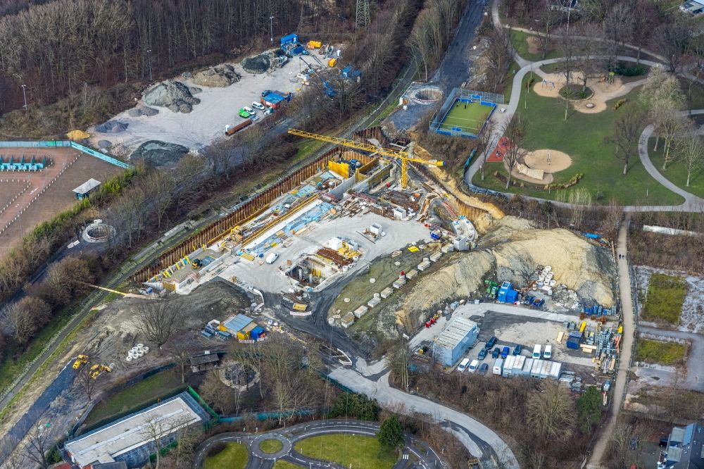 Essen from the bird's eye view: Construction site with earthworks and landfills for the laying of pipelines for the sewer on Berne in Nordpark in Essen at Ruhrgebiet in the state North Rhine-Westphalia, Germany