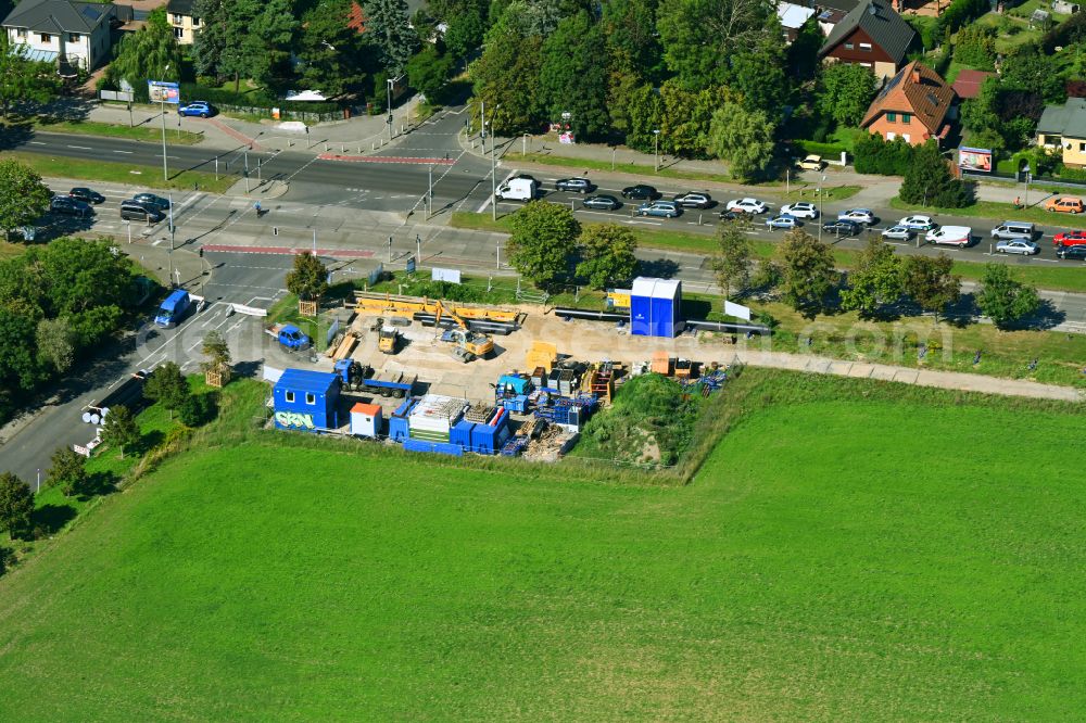 Aerial image Berlin - Construction site with earthworks and landfills for the laying of pipelines of the Berliner Wasserbetriebe on street B1- Kressenweg in the district Mahlsdorf in Berlin, Germany