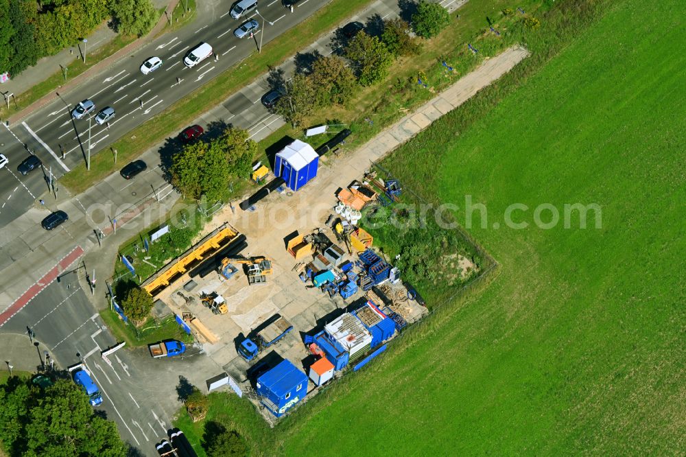 Berlin from above - Construction site with earthworks and landfills for the laying of pipelines of the Berliner Wasserbetriebe on street B1- Kressenweg in the district Mahlsdorf in Berlin, Germany