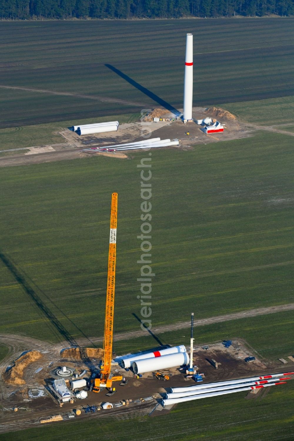 Willmersdorf from the bird's eye view: Construction site for wind turbine installation on fields in Willmersdorf in the state Brandenburg, Germany