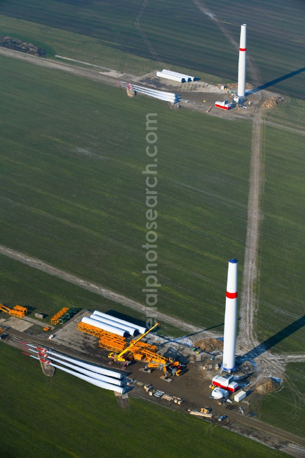 Willmersdorf from the bird's eye view: Construction site for wind turbine installation on fields in Willmersdorf in the state Brandenburg, Germany