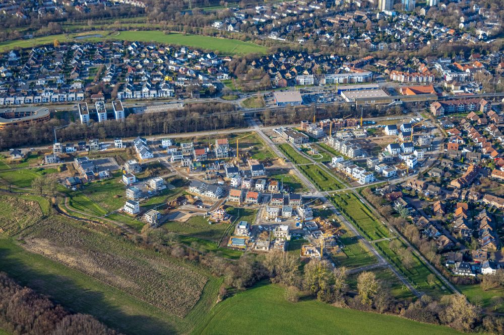 Duisburg from above - Construction sites for new construction residential area of detached housing estate Angerbogen on street Hermann-Spillecke-Strasse in the district Huckingen in Duisburg at Ruhrgebiet in the state North Rhine-Westphalia, Germany