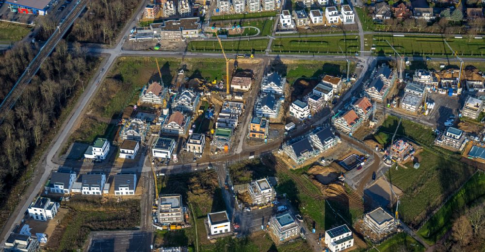 Duisburg from the bird's eye view: Construction sites for new construction residential area of detached housing estate Angerbogen on street Hermann-Spillecke-Strasse in the district Huckingen in Duisburg at Ruhrgebiet in the state North Rhine-Westphalia, Germany