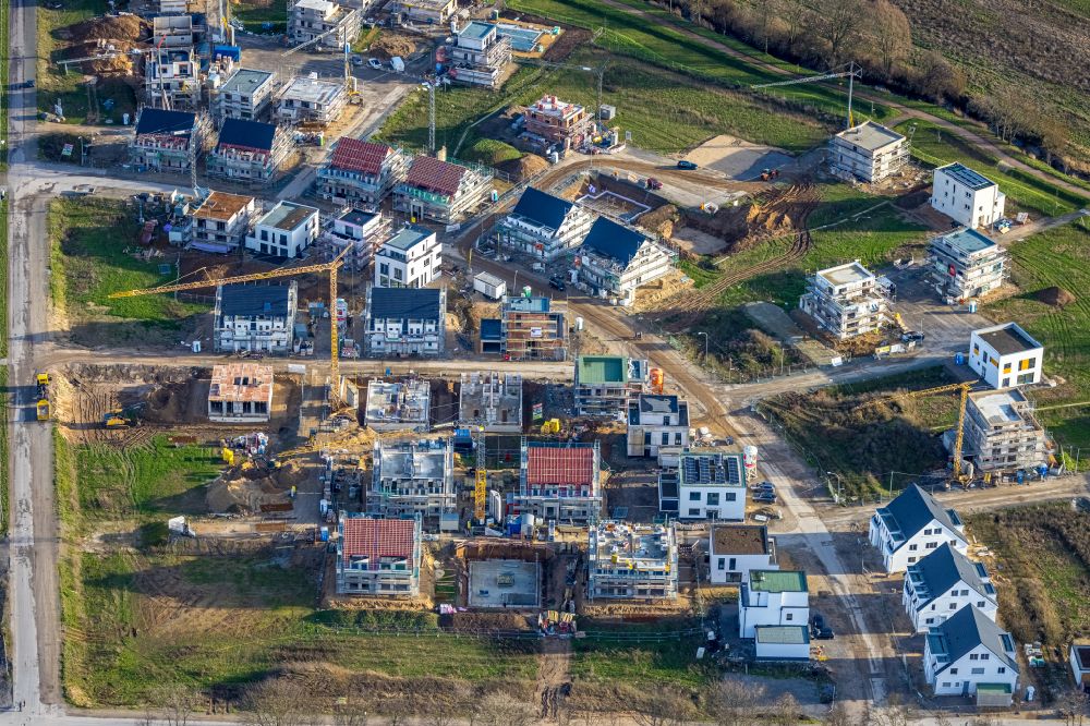 Duisburg from above - Construction sites for new construction residential area of detached housing estate Angerbogen on street Hermann-Spillecke-Strasse in the district Huckingen in Duisburg at Ruhrgebiet in the state North Rhine-Westphalia, Germany