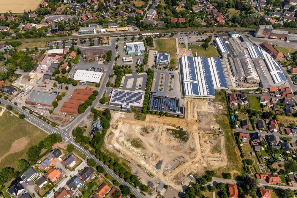 Drensteinfurt from the bird's eye view: Construction sites for new construction residential area of detached housing estate on Konrad-Adenauer-Strasse in Drensteinfurt in the state North Rhine-Westphalia, Germany