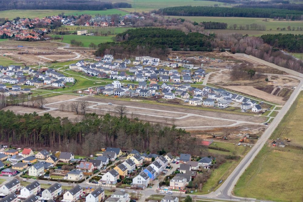 Ludwigsfelde from above - Construction sites for new construction residential area of detached housing estate on Sartrering in Ludwigsfelde in the state Brandenburg, Germany