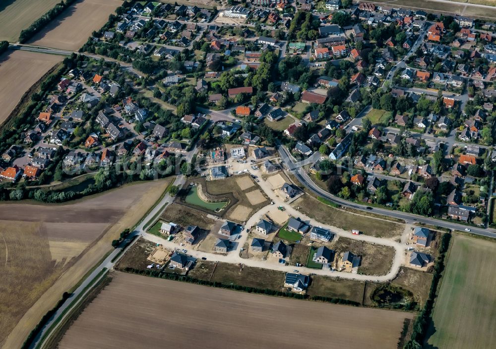 Aerial image Stein - Construction sites for new construction residential area of detached housing estate on street Kirchkoppel in Stein in the state Schleswig-Holstein, Germany
