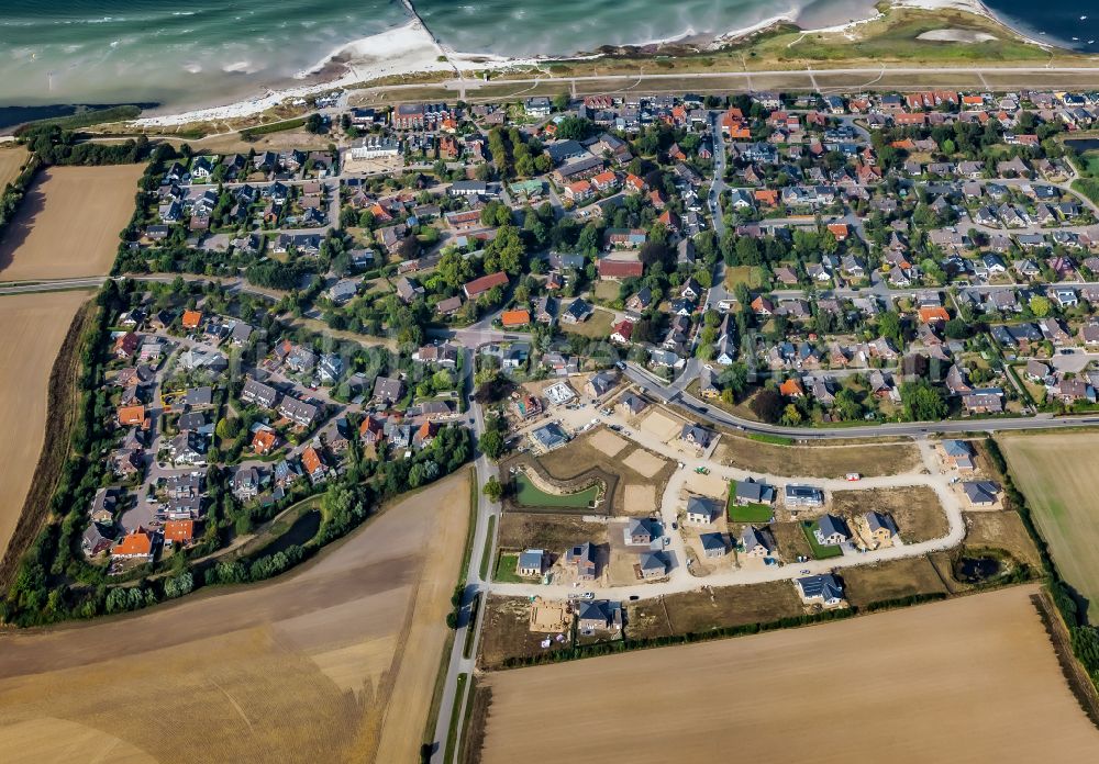 Stein from above - Construction sites for new construction residential area of detached housing estate on street Kirchkoppel in Stein in the state Schleswig-Holstein, Germany