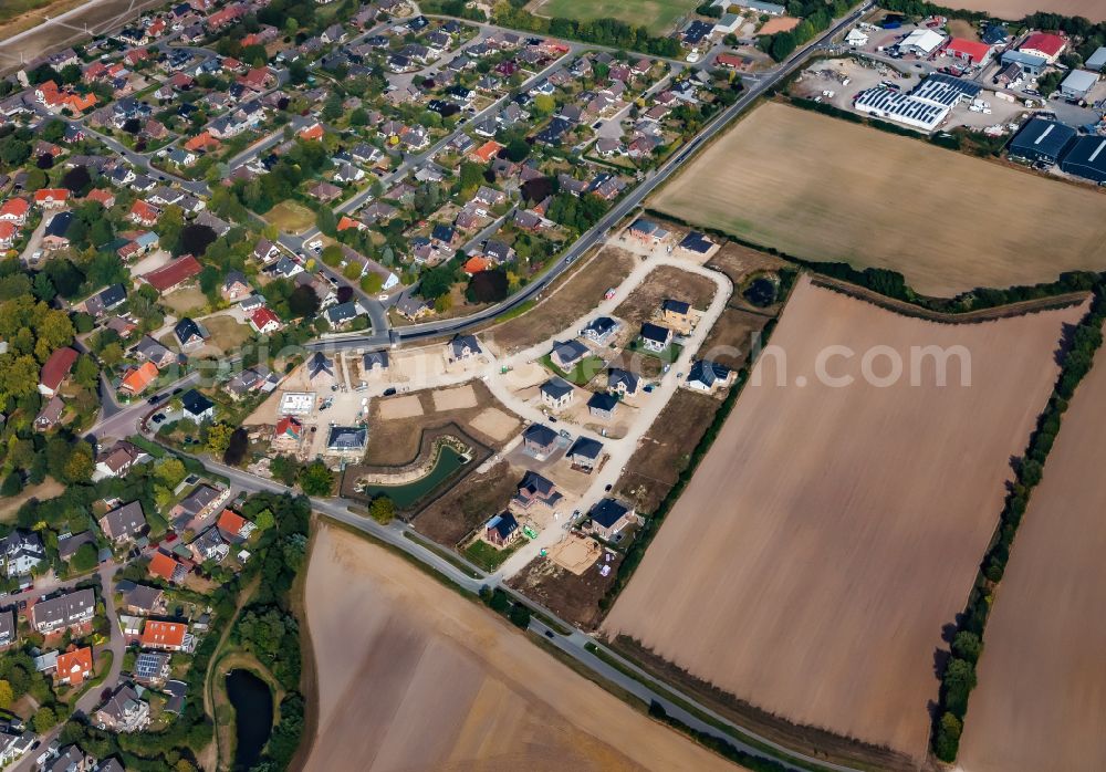 Aerial image Stein - Construction sites for new construction residential area of detached housing estate on street Kirchkoppel in Stein in the state Schleswig-Holstein, Germany