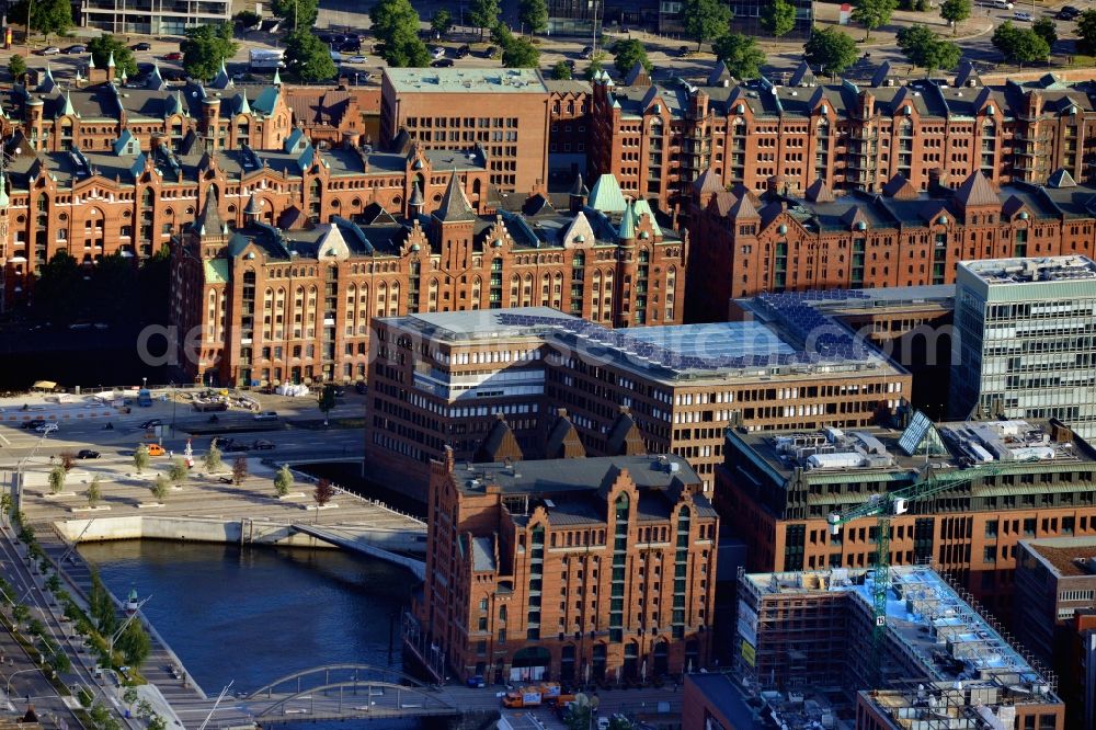 Hamburg from above - View of some old and new buildings situated in the Hafencity near Brooktorkai in the district Hamburg - Mitte. Including the International Maritime Museum, a new residence built by the company Germanische Lloyd and the listed Speicherstadt.The buildings are separated by the Brooktorhafen and the Brooktorkai