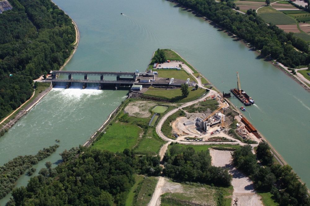 Village-Neuf from above - At Village-Neuf in France, the Grand Canal d'Alsace begins. The French company EdF builds a small power plant and a fish ladder. Thus, the residual amount of water for the Old Rhine is utilized to produce electricity