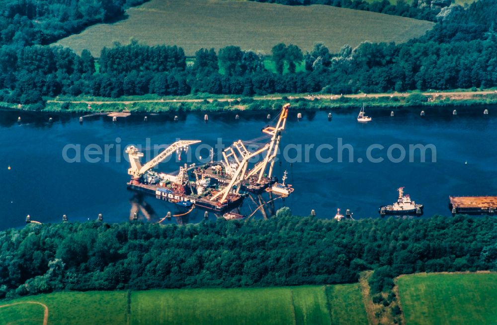 Dückerswisch from the bird's eye view: Salvage processing on ship - wreck Scrap freighter UNO in the Canal in Dueckerswisch in the state Schleswig-Holstein, Germany